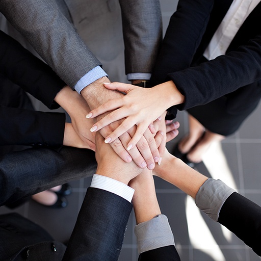 Business team joining hands — supply chain consulting services