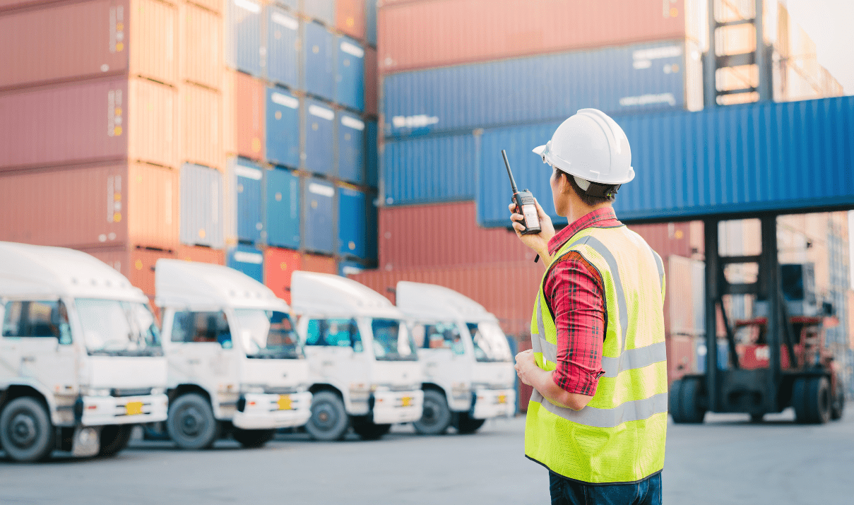 Foreman at container port with trucks